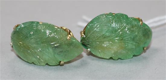 A pair of yellow metal and carved emerald ear clips, 23mm.